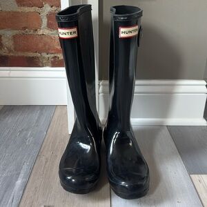 Black tall shiny hunter boots